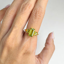 Load image into Gallery viewer, 5 x 8 mm. Octagon Cut Green Pakistani Peridot Trilogy Ring