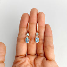 Load image into Gallery viewer, 5 x 7 mm. Oval Cut Sky Blue Brazilian Topaz with Cz Halo Drop Earrings