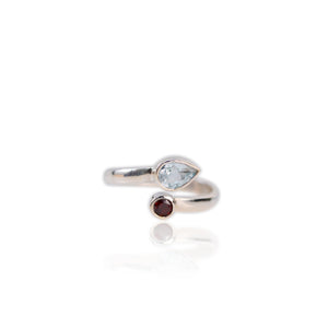 5 x 7 mm. Pear Cut Sky Blue Brazilian Topaz and Garnet Open Ring