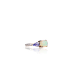 7 x 9 mm. Oval Cabochon Multi-coloured Ethiopian Opal and Tanzanite Trilogy Ring