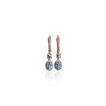 Load image into Gallery viewer, 5 x 7 mm. Oval Cut Sky Blue Brazilian Topaz with Cz Halo Drop Earrings
