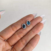 Load image into Gallery viewer, 5 x 7 mm. Oval Cut London Blue Brazilian Topaz with Cz Accents Earrings
