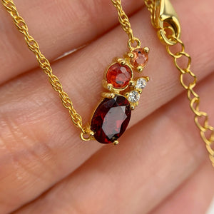 5 x 7 mm. Oval Cut Red African Garnet and Sapphire with Cz Accents Cluster Necklace