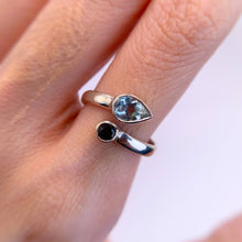 Load image into Gallery viewer, 5 x 7 mm. Pear Cut Sky Blue Brazilian Topaz and Garnet Open Ring
