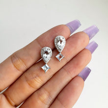 Load image into Gallery viewer, 5 x 9 mm. Pear Cut Light Blue Brazilian Aquamarine with Cz Halo Earrings
