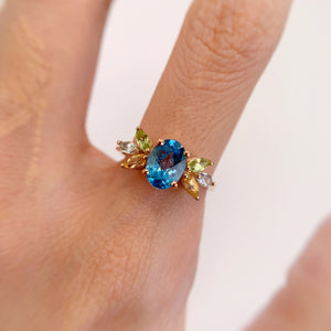 6 x 8 mm. Oval with Checkerboard Cut Swiss Blue Brazilian Topaz, Citrine and Peridot Cluster Ring