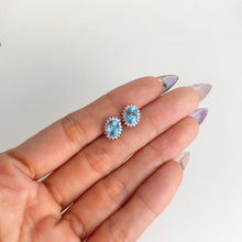 Load image into Gallery viewer, 5 x 7 mm. Oval Cut Swiss Blue Brazilian Topaz with Cz Accents Earrings

