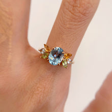 Load image into Gallery viewer, 6 x 8 mm. Oval Cut Sky Blue Brazilian Topaz, Citrine and Peridot Cluster Ring
