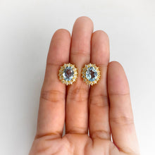 Load image into Gallery viewer, 7 x 9 mm. Oval Cut Sky Blue Brazilian Topaz with Cz Accents Earrings
