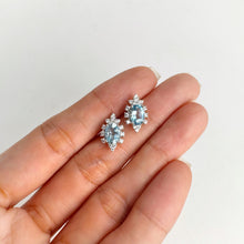 Load image into Gallery viewer, 5 x 7 mm. Oval Cut Swiss Blue Brazilian Topaz with Cz Accents Earrings
