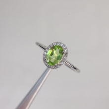 Load and play video in Gallery viewer, 5 x 7 mm. Oval Cut Green Pakistani Peridot with Cz Halo Ring
