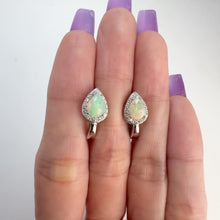 Load and play video in Gallery viewer, 5 x 7 mm. Pear Cabochon Multi-coloured Ethiopian Opal with Cz Halo Earrings
