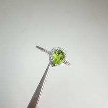 Load and play video in Gallery viewer, 5 x 7 mm. Pear Cut Green Pakistani Peridot with Cz Halo Ring
