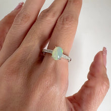 Load and play video in Gallery viewer, 6 x 8 mm. Oval Cabochon Multi-coloured Ethiopian Opal with Cz Accents Ring
