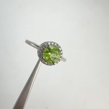 Load and play video in Gallery viewer, 7 mm. Round Cut Green Pakistani Peridot with Cz Halo Ring

