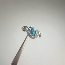 Load and play video in Gallery viewer, 5 x 7 mm. Pear Cut Sky Blue Brazilian Topaz with Cz Accents Ring
