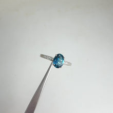 Load and play video in Gallery viewer, 6 x 8 mm. Oval Cut London Blue Brazilian Topaz with Cz Accents Ring
