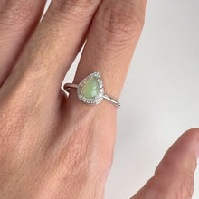 Load and play video in Gallery viewer, 5 x 7 mm. Pear Cabochon Multi-coloured Ethiopian Opal with Cz Halo Ring
