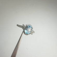 Load and play video in Gallery viewer, 6 x 8 mm. Oval Cut Sky Blue Brazilian Topaz with Cz Accents Ring
