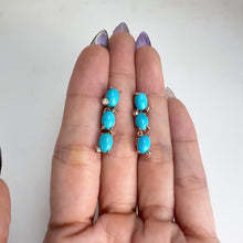Load and play video in Gallery viewer, 5 x 7 mm. Oval Cabochon Blue American Turquoise with Cz Accents Drop Earrings
