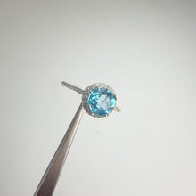 Load and play video in Gallery viewer, 7 mm. Round Cut Swiss Blue Brazilian Topaz with Cz Halo Ring
