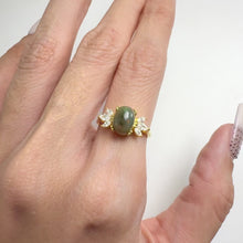 Load and play video in Gallery viewer, 6 x 8 mm. Oval Cabochon Black Ethiopian Opal with Cz Accents Ring
