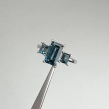 Load and play video in Gallery viewer, 5 x 8 mm. Octagon Cut London Blue Brazilian Topaz Trilogy Ring
