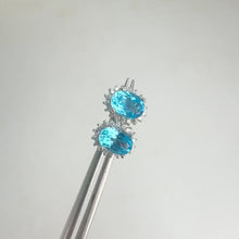 Load and play video in Gallery viewer, 5 x 7 mm. Oval Cut Swiss Blue Brazilian Topaz with Cz Accents Earrings
