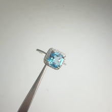 Load and play video in Gallery viewer, 7 mm. Cushion Cut Swiss Blue Brazilian Topaz with Cz Halo Ring

