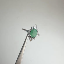 Load and play video in Gallery viewer, 6 x 8 mm. Oval Cut Green Zambian Emerald with Topaz Accents Ring
