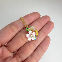 Load and play video in Gallery viewer, 11 mm. Carved Flower Mother of Pearl with Cz Accents Pendant and Necklace
