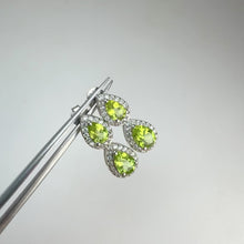 Load and play video in Gallery viewer, 5 x 7 mm. Pear Cut Green Pakistani Peridot with Cz Halo Earrings
