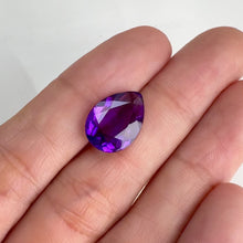 Load and play video in Gallery viewer, 10 x 14 mm. Pear Cut Purple Brazilian Amethyst
