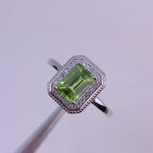 Load and play video in Gallery viewer, 5 x 7 mm. Octagon Cut Green Pakistani Peridot with Cz Halo Ring
