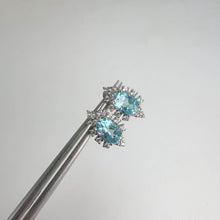 Load and play video in Gallery viewer, 5 x 7 mm. Oval Cut Swiss Blue Brazilian Topaz with Cz Accents Earrings
