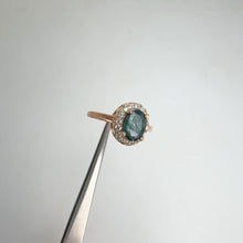 Load and play video in Gallery viewer, 6 x 8 mm. Oval Cut Blue Green Thai Sapphire with Cz Halo Ring
