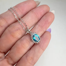 Load and play video in Gallery viewer, 6 x 8 mm. Oval Cut London Blue Brazilian Topaz with Cz Accents Pendant and Necklace
