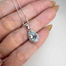 Load and play video in Gallery viewer, 6 x 8 mm. Pear Cut Light Blue Brazilian Aquamarine with Cz Halo Pendant and Necklace
