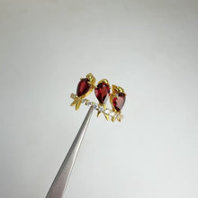 Load and play video in Gallery viewer, 5 x 7 mm. Pear Cut Red Mozambican Garnet with Cz Accents Bird Ring
