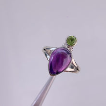 Load and play video in Gallery viewer, Handmade 8 x 12 mm. Pear Cabochon Purple Brazilian Amethyst and Peridot Ring
