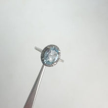 Load and play video in Gallery viewer, 6 x 8 mm. Oval Cut Sky Blue Brazilian Topaz with Cz Halo Ring
