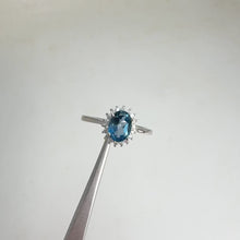 Load and play video in Gallery viewer, 5 x 7 mm. Oval Cut London Blue Brazilian Topaz with Cz Accents Ring
