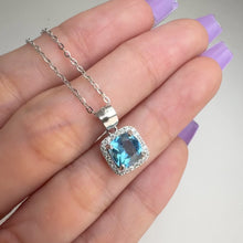 Load and play video in Gallery viewer, 7 mm. Cushion Cut Swiss Blue Brazilian Topaz with Cz Halo Pendant and Necklace
