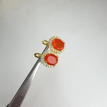 Load and play video in Gallery viewer, 7 x 9 mm. Oval Cut Orange Indian Carnelian with Cz Accents Earrings
