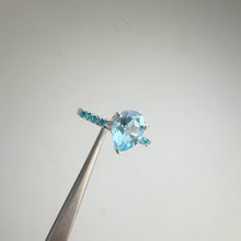 Load and play video in Gallery viewer, 7 x 9 mm. Pear Cut Sky Blue Brazilian Topaz with Cz Accents Ring
