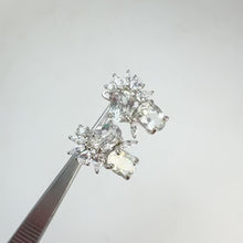 Load and play video in Gallery viewer, 6 x 8 mm. Oval Cut White Brazilian Topaz with Cz Accents Cluster Earrings
