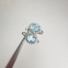 Load and play video in Gallery viewer, 6 x 8 mm. Oval Cut Sky Blue Brazilian Topaz with Cz Accents Earrings
