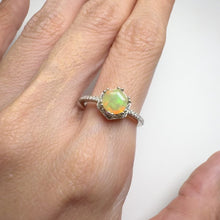 Load and play video in Gallery viewer, 6 mm. Hexagon Cut Multi-coloured Ethiopian Opal with Cz Halo Ring
