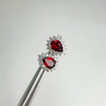 Load and play video in Gallery viewer, 5 x 7 mm. Pear Cut Red Mozambican Garnet Cz Accents Earrings
