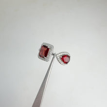 Load and play video in Gallery viewer, 5 x 7 mm. Octagon Cut Red Mozambican Garnet with Cz Halo Open Ring
